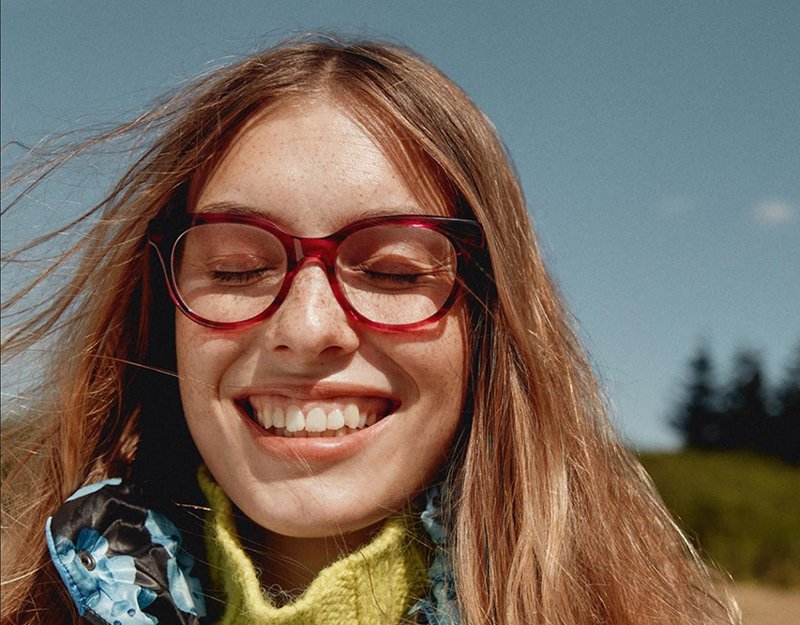 a lady wearing red glasses